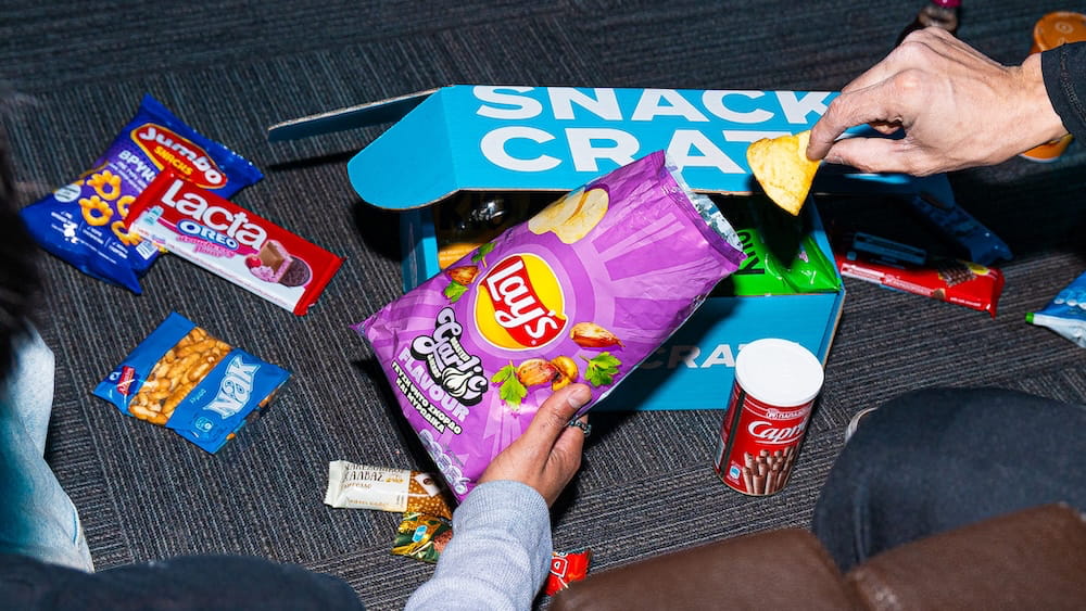 person exploring snacks from around the world